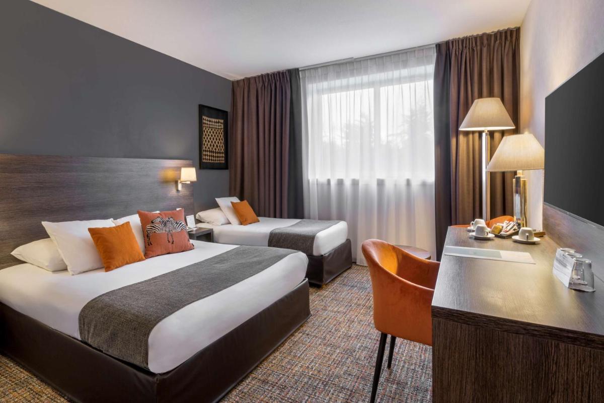 Un ou plusieurs lits dans un hébergement de l'établissement Best Western Plus Hotel Admiral