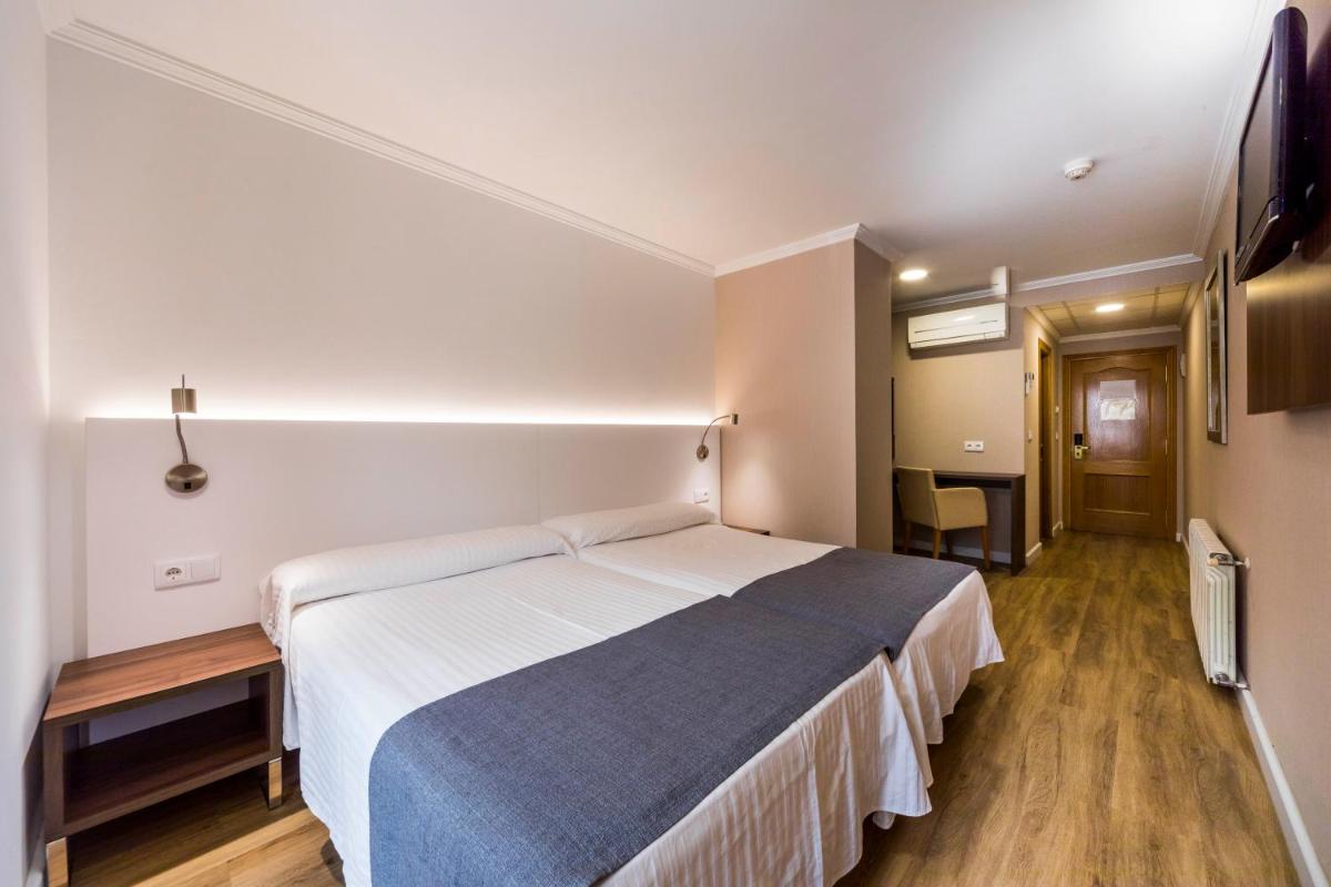 Cama o camas de una habitación en Hotel Rosaleda del Mijares