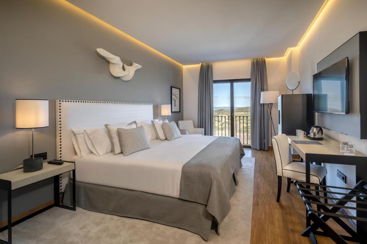 Cama o camas de una habitación en Barceló Aracena & Spa