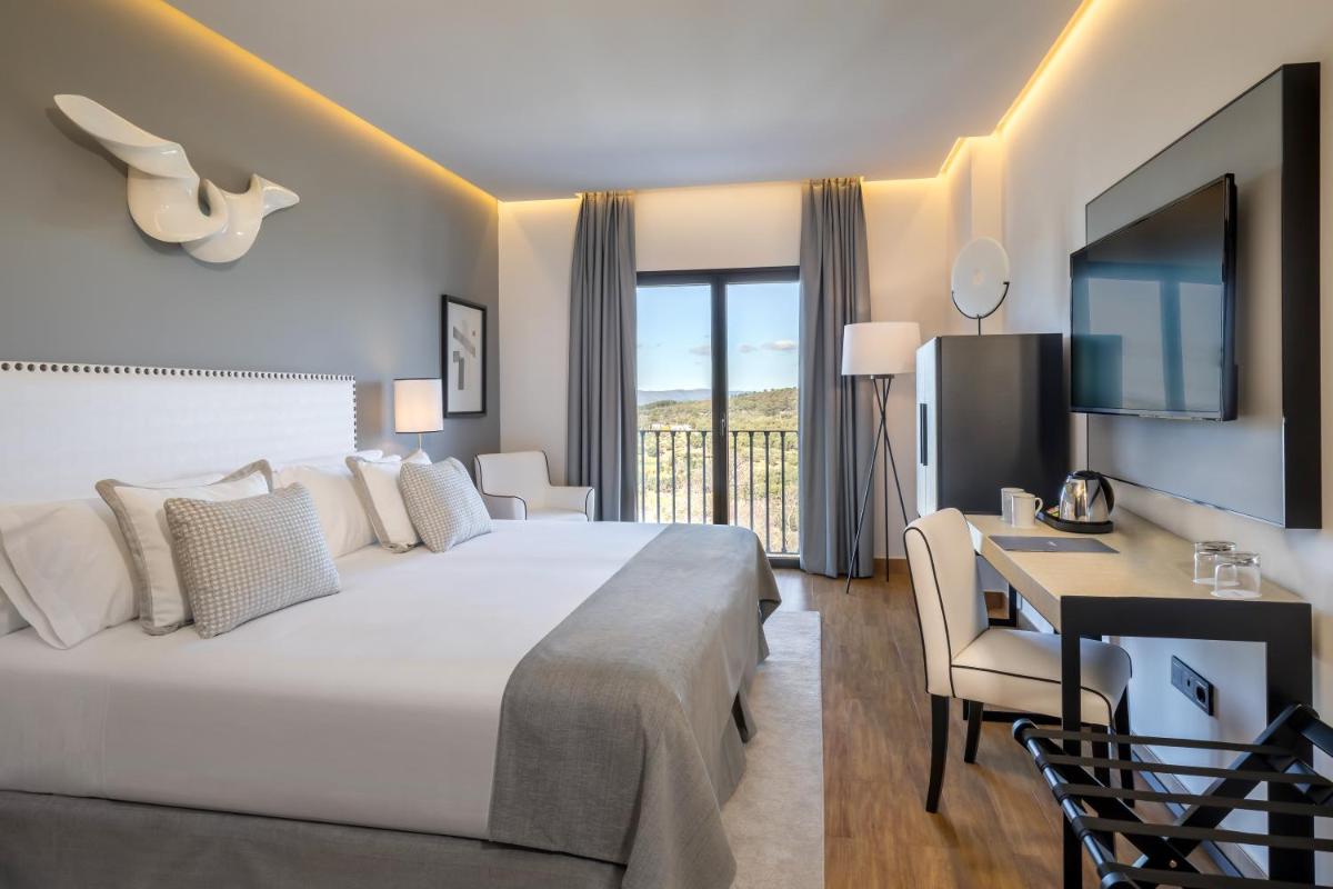 Cama o camas de una habitación en Barceló Aracena & Spa