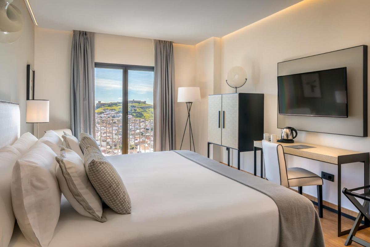 Cama o camas de una habitación en Barceló Aracena & Spa