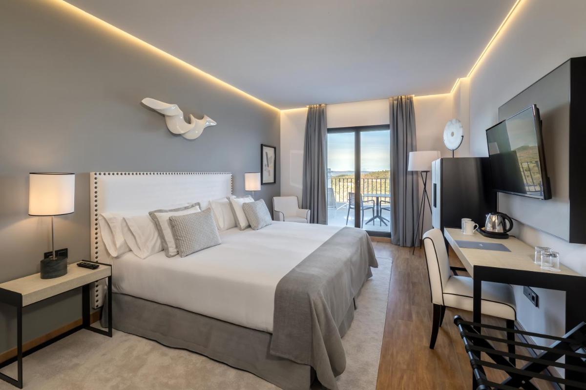 Cama o camas de una habitación en Barceló Aracena & Spa