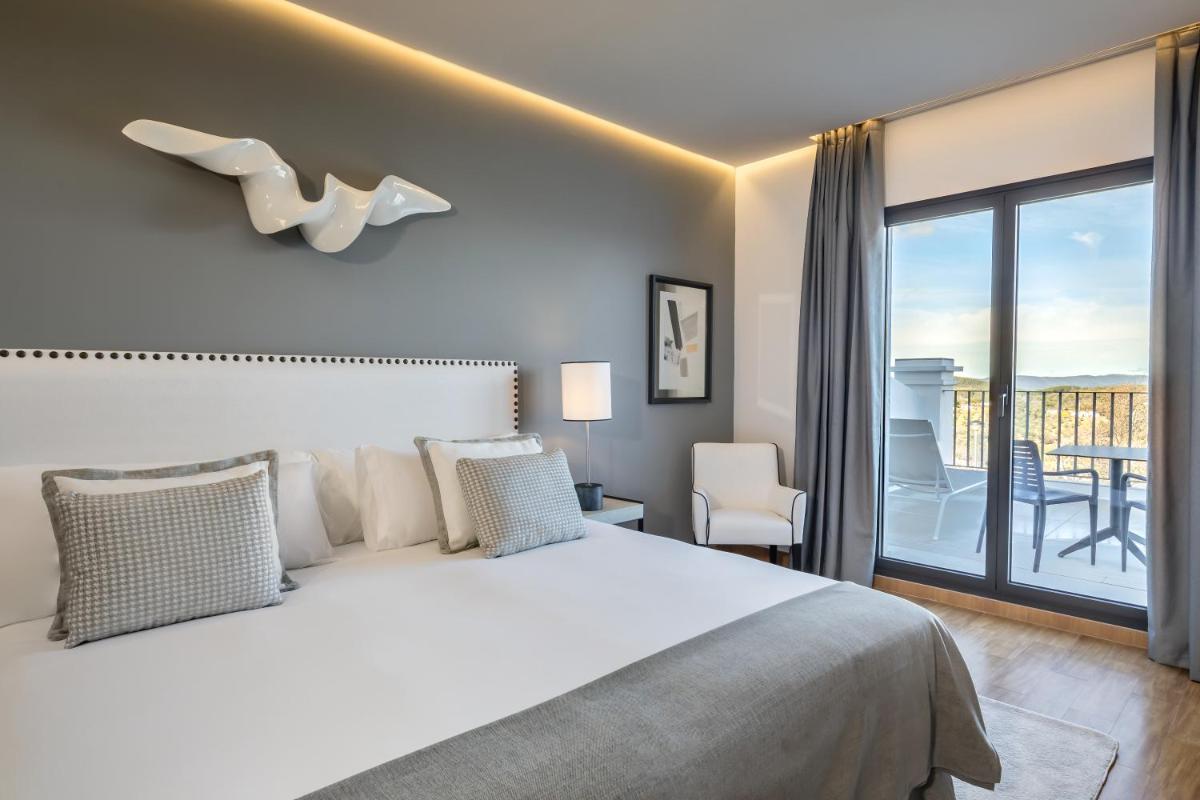 Cama o camas de una habitación en Barceló Aracena & Spa