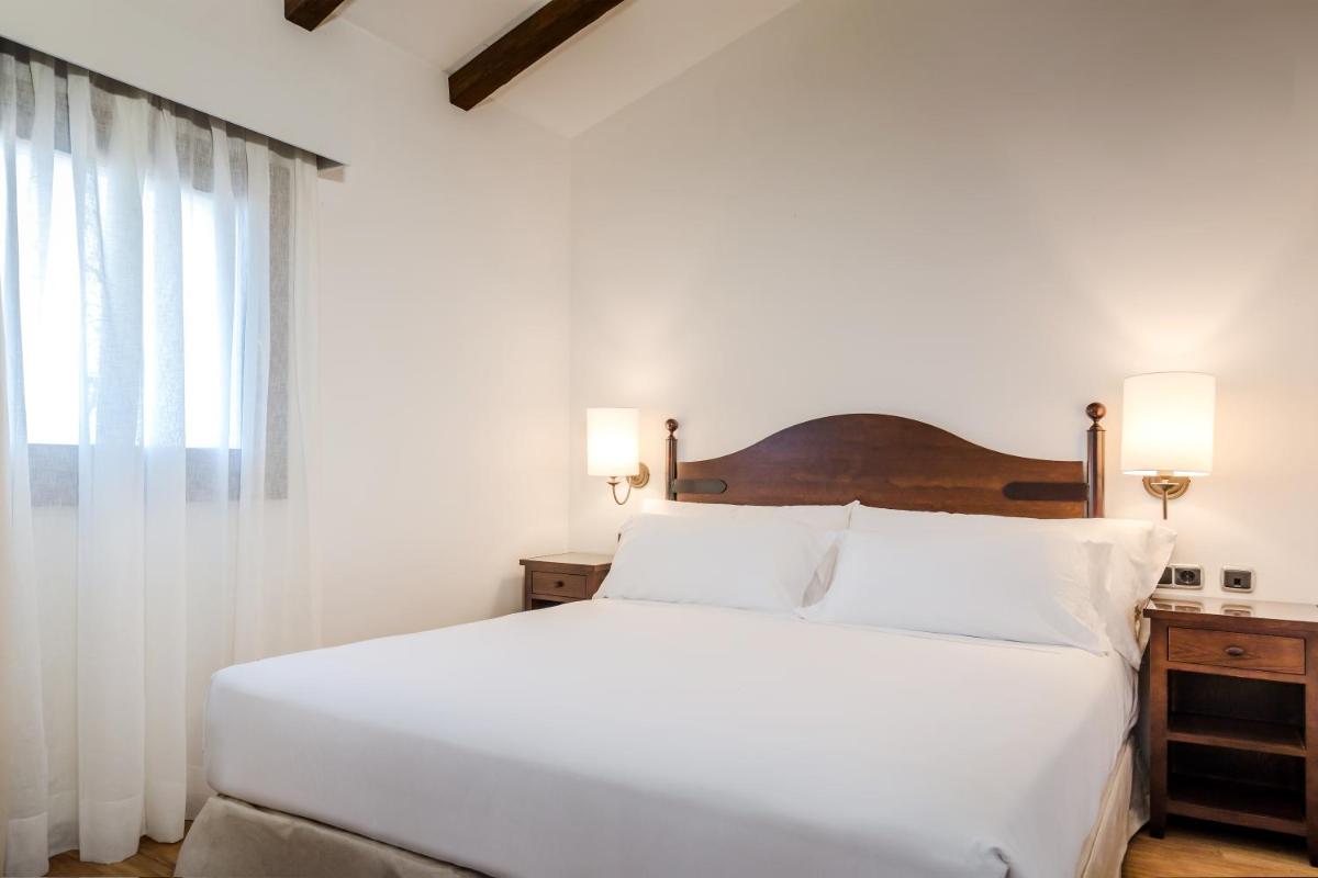 Cama o camas de una habitación en Barceló Aracena & Spa