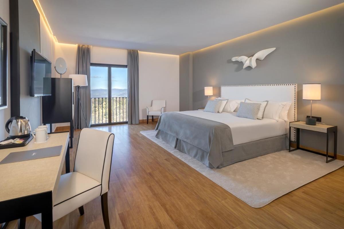 Cama o camas de una habitación en Barceló Aracena & Spa