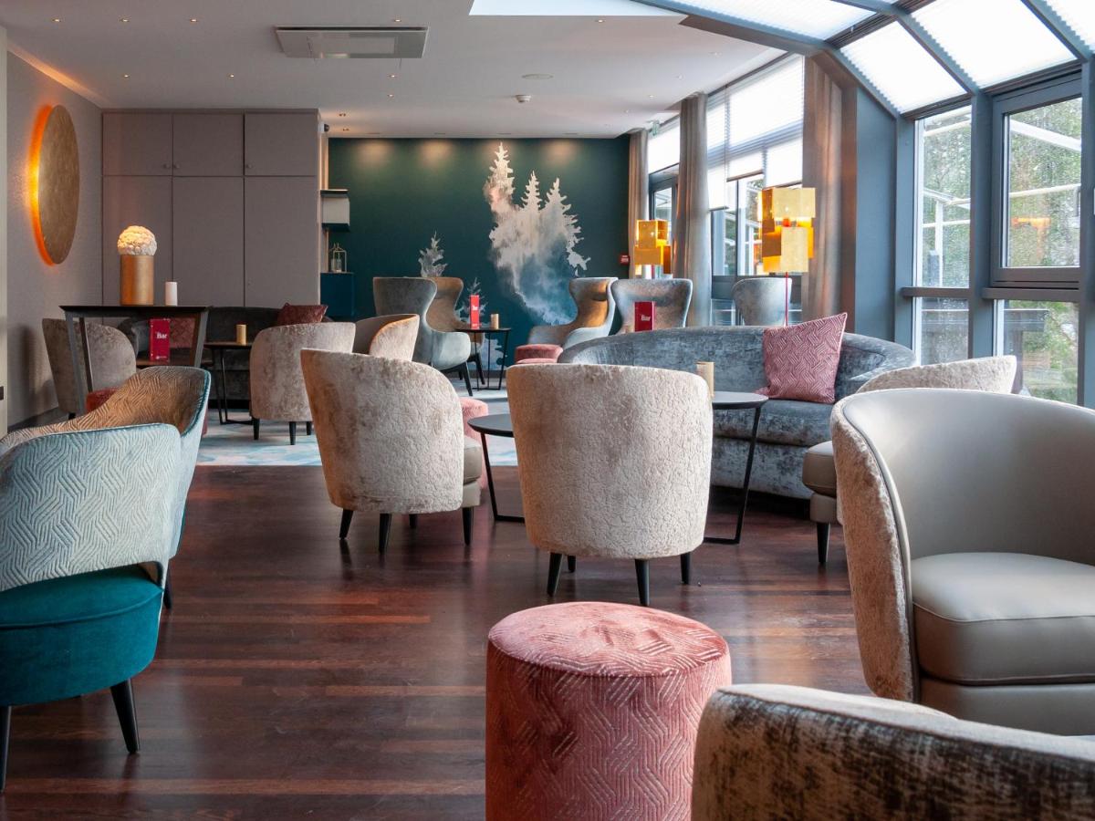 Coin salon dans l'établissement Hotel Restaurant & Spa Verte Vallée