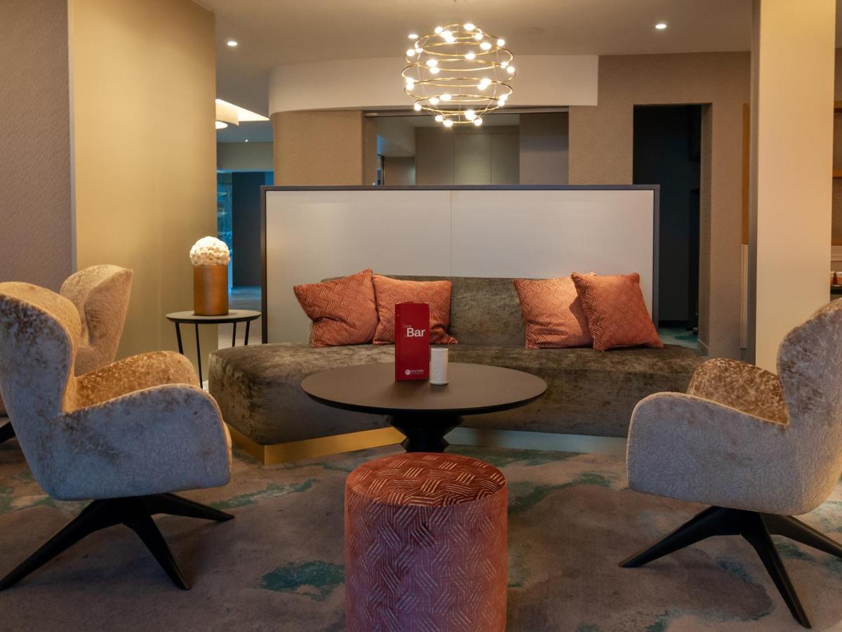 Coin salon dans l'établissement Hotel Restaurant & Spa Verte Vallée