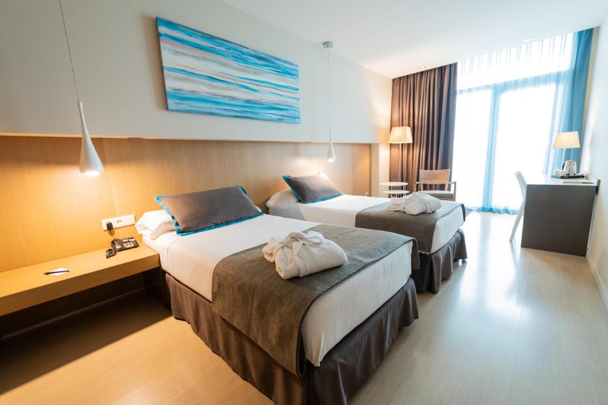 Cama o camas de una habitación en Atenea Port Barcelona Mataró
