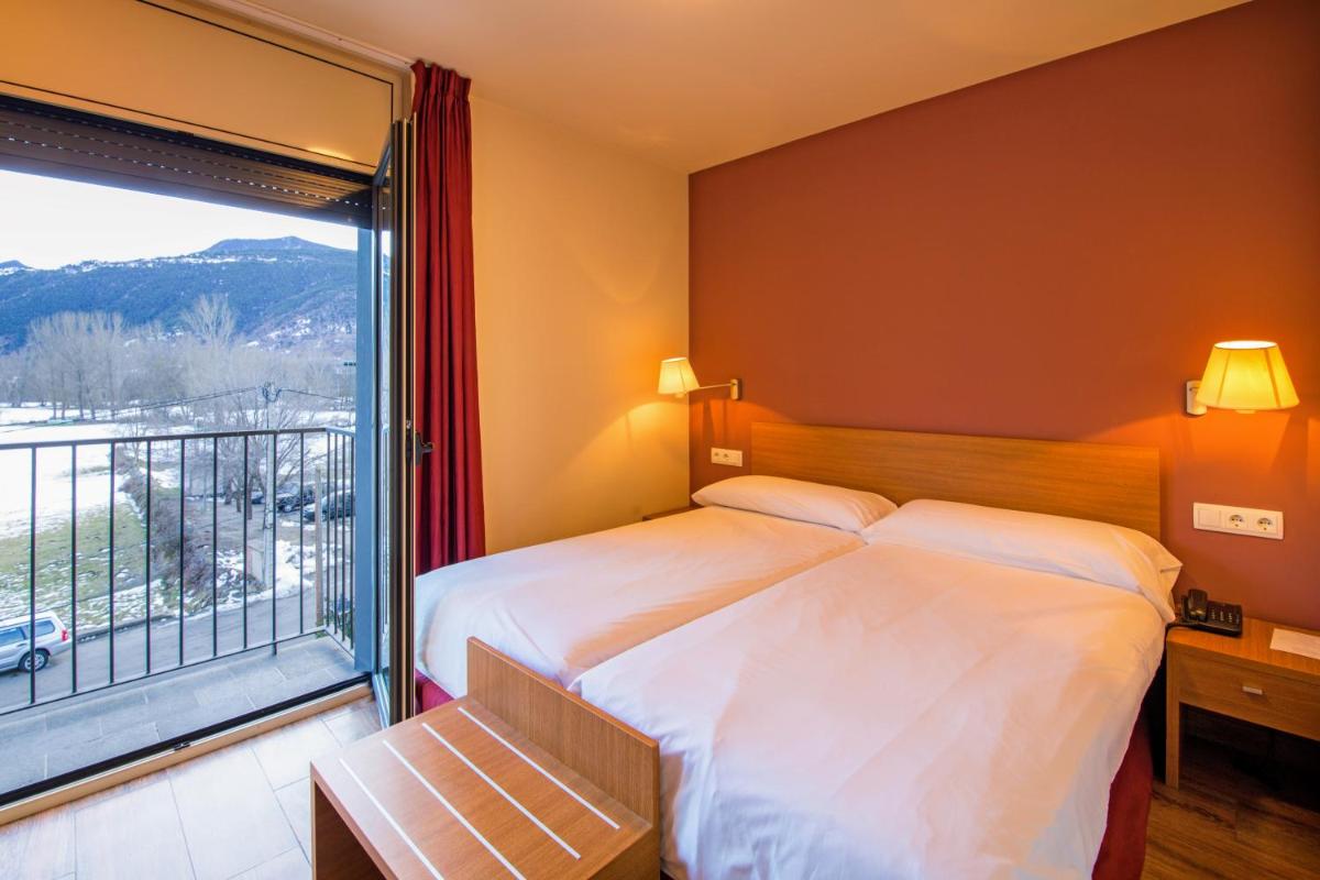 Cama o camas de una habitación en Aparthotel Trainera