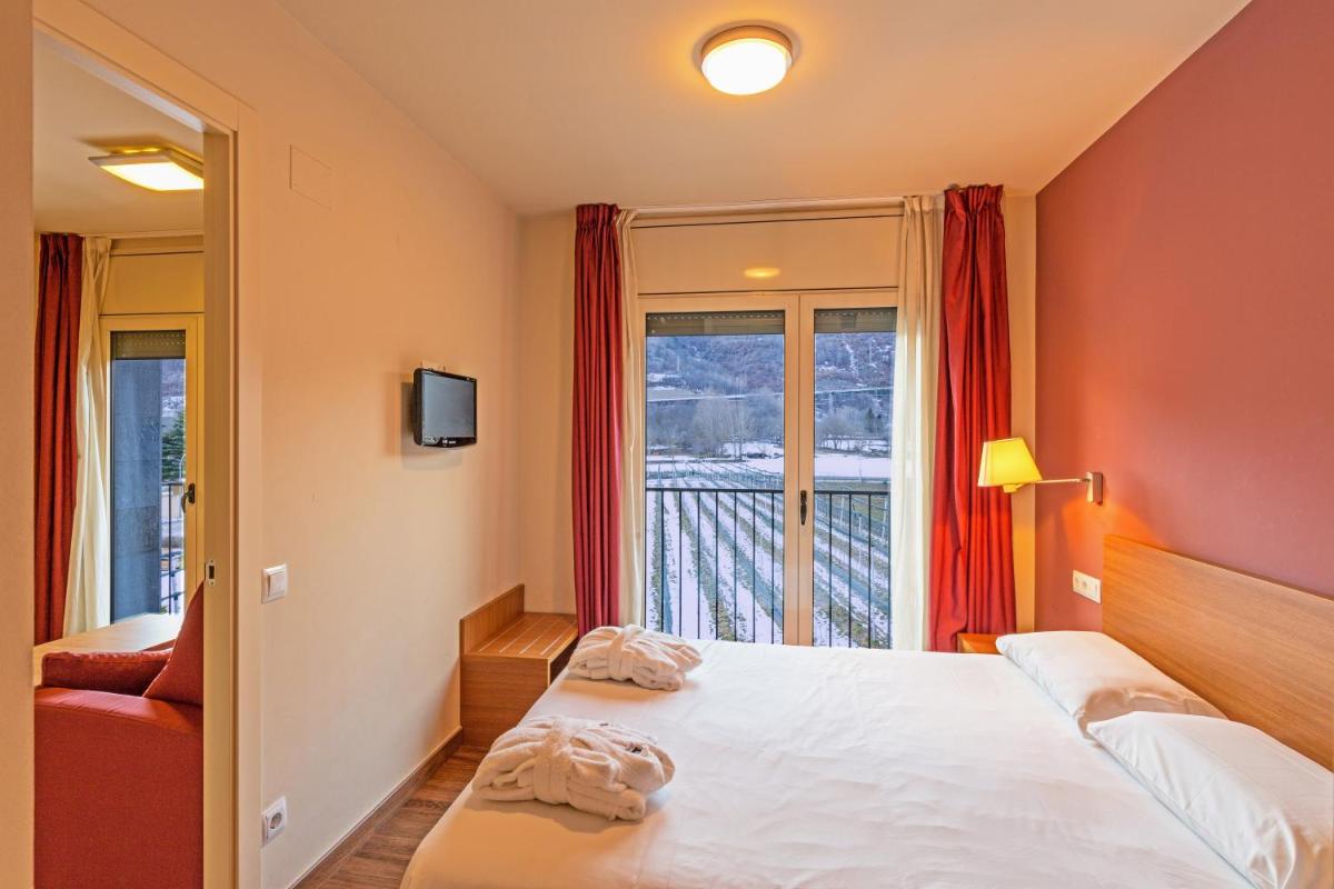 Cama o camas de una habitación en Aparthotel Trainera