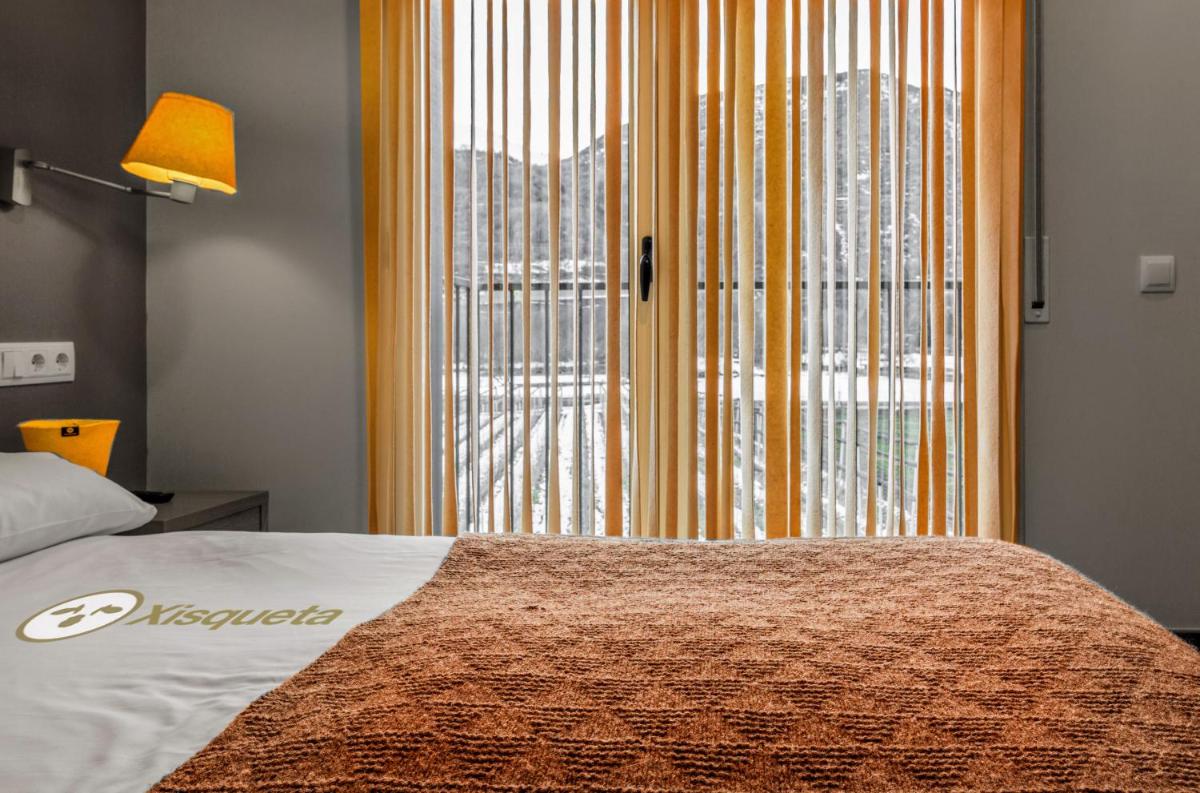 Cama o camas de una habitación en Aparthotel Trainera