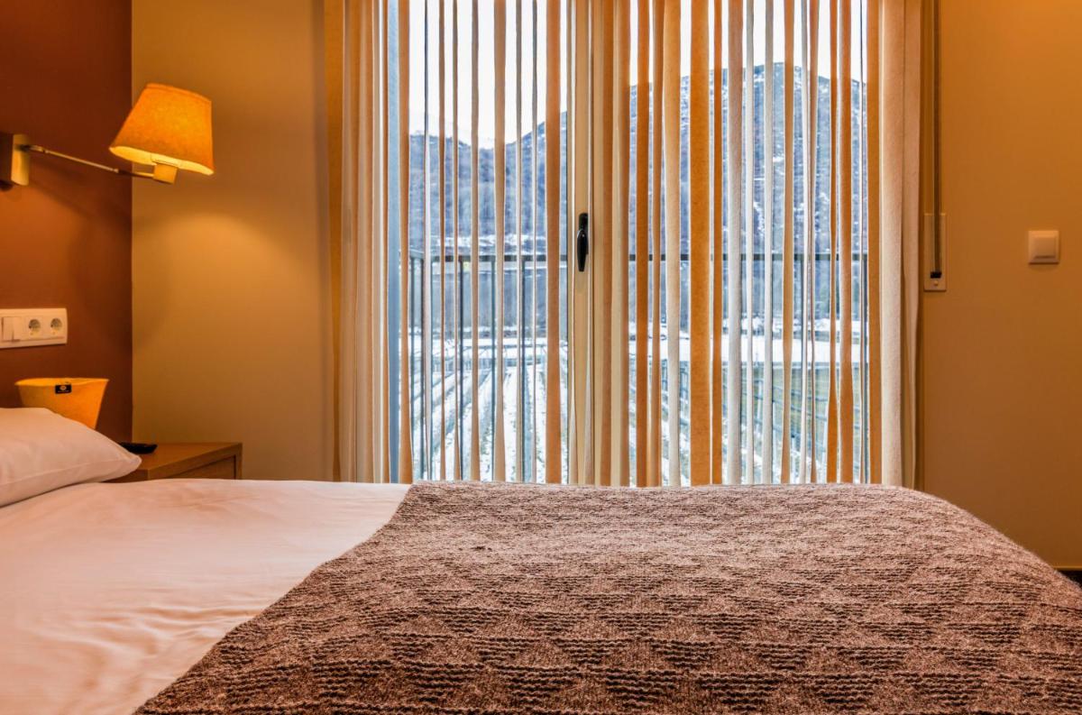 Cama o camas de una habitación en Aparthotel Trainera