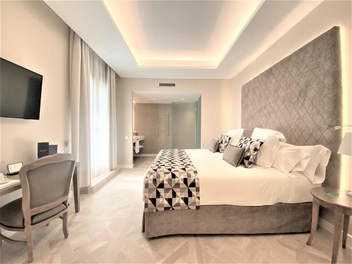Cama o camas de una habitación en Lamaro Hotel