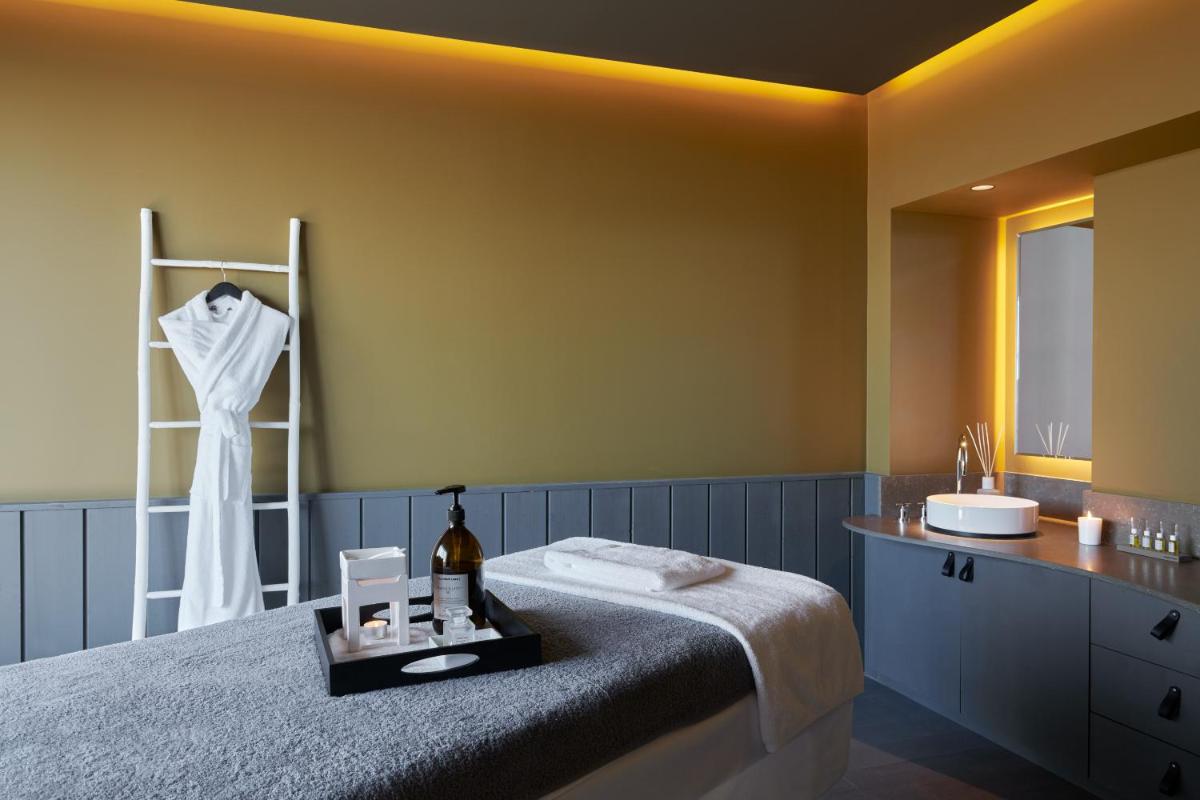 Un ou plusieurs lits dans un hébergement de l'établissement Hôtel Plage Palace & Spa