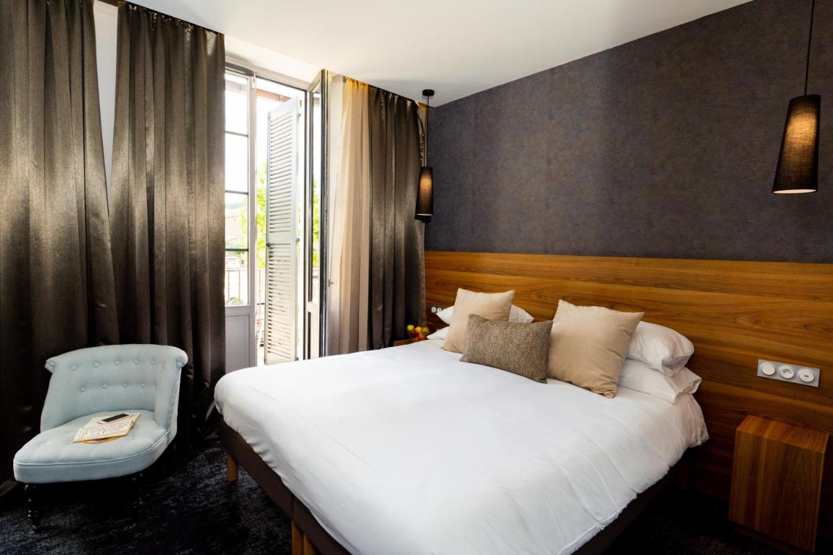 Un ou plusieurs lits dans un hébergement de l'établissement Fac & Spera -Hôtel & Spa