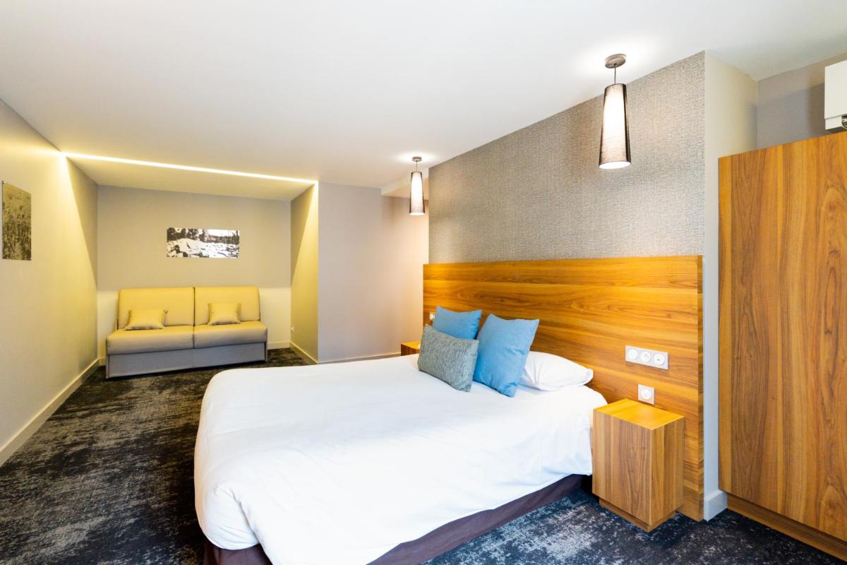 Un ou plusieurs lits dans un hébergement de l'établissement Fac & Spera -Hôtel & Spa