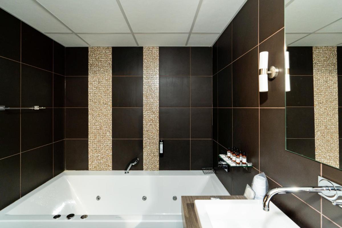 Salle de bains dans l'établissement Fac & Spera -Hôtel & Spa