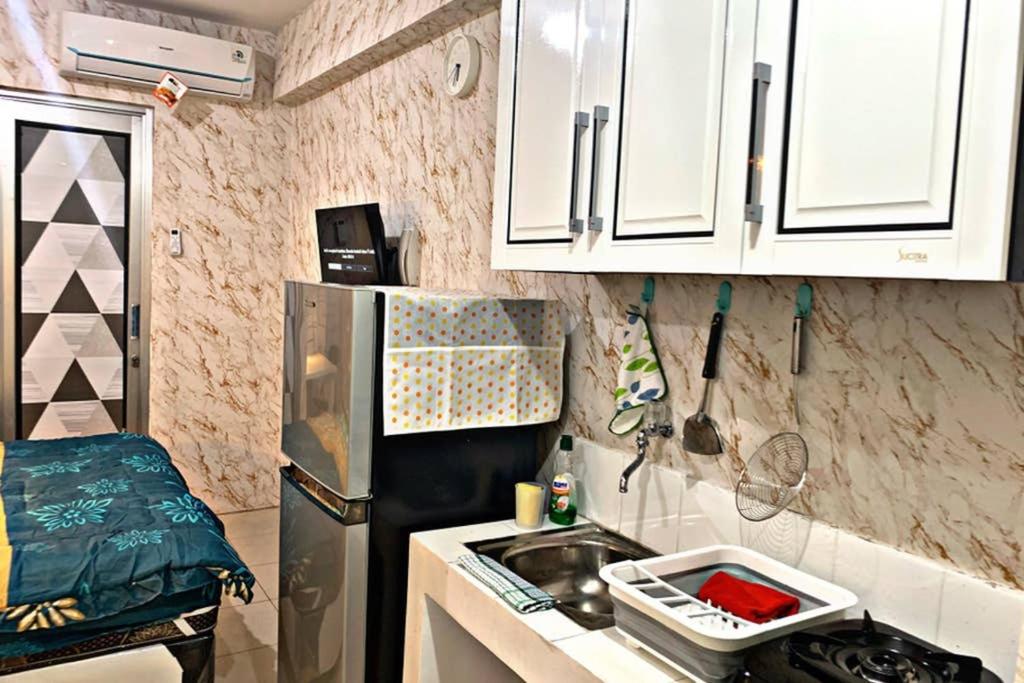 Minimalist Studio 1BR at Green Bay Pluit Apartment - Housity