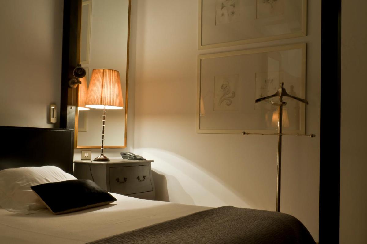 Cama o camas de una habitación en Hotel La Malcontenta