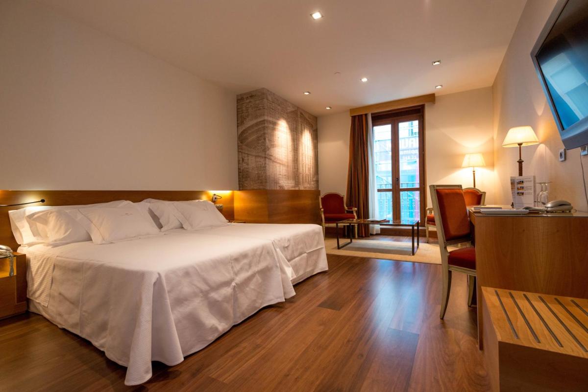 Cama o camas de una habitación en Gran Hotel La Perla