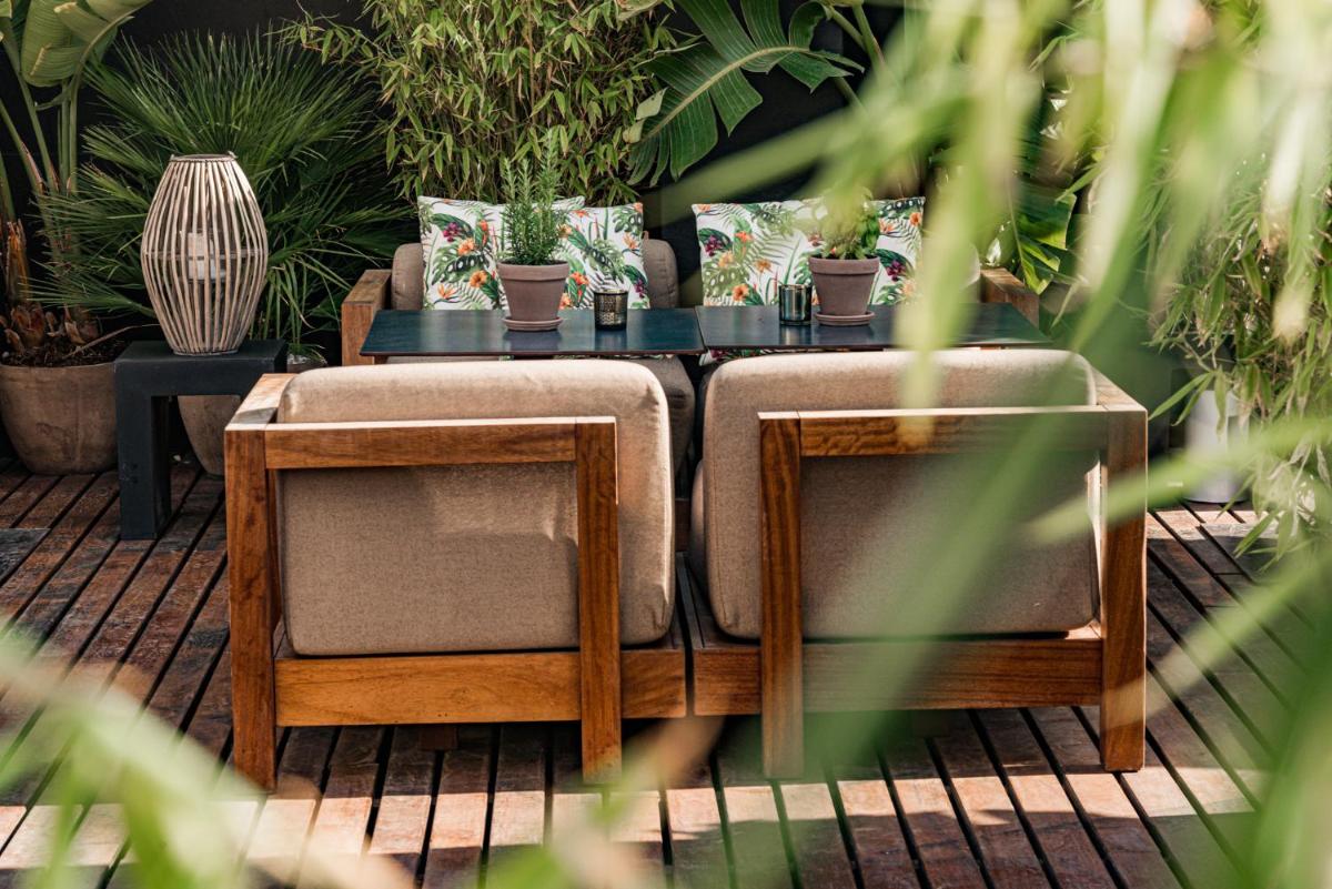 Jardín al aire libre en Puro Hotel Oasis Urbano