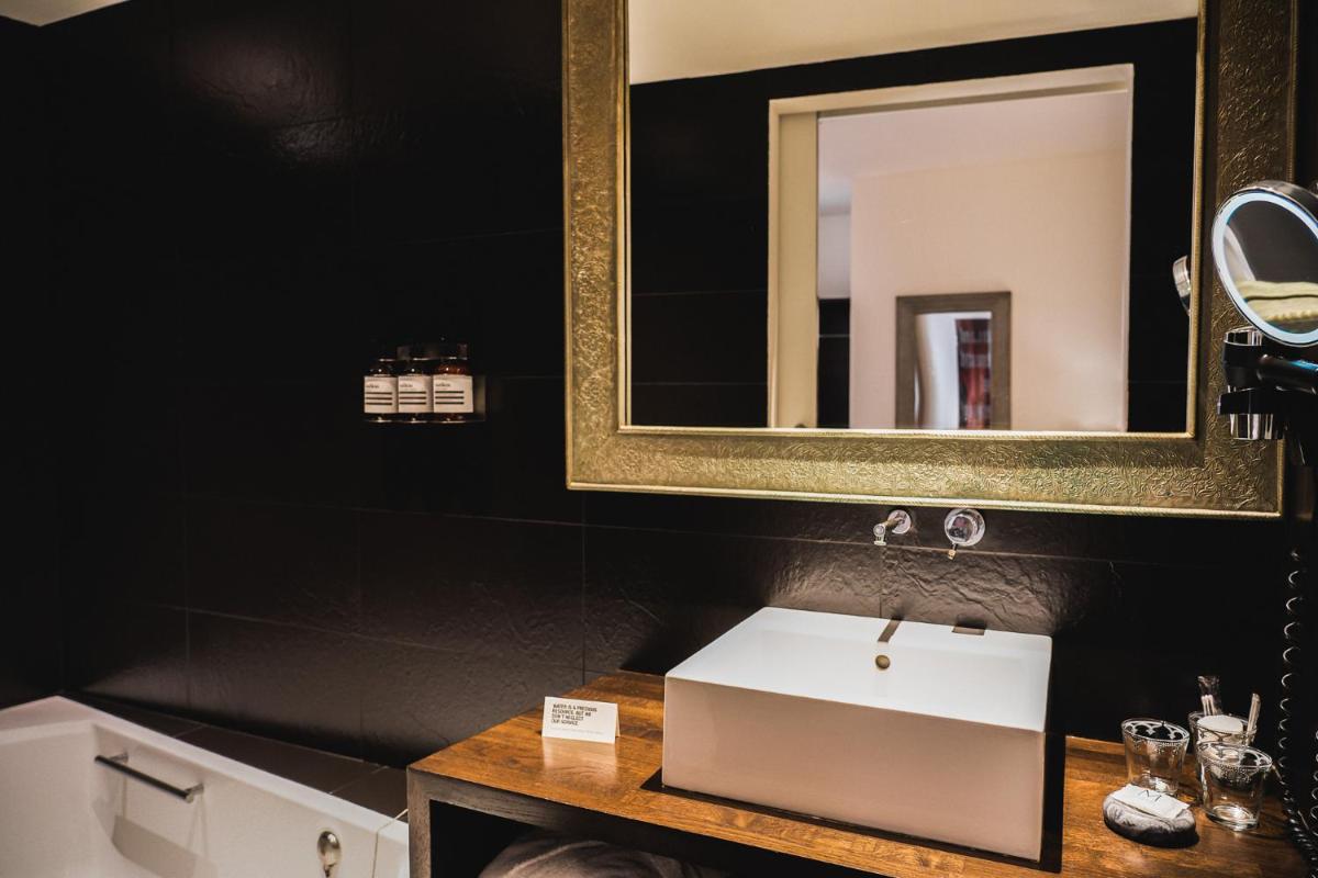 Un baño de Puro Hotel Oasis Urbano
