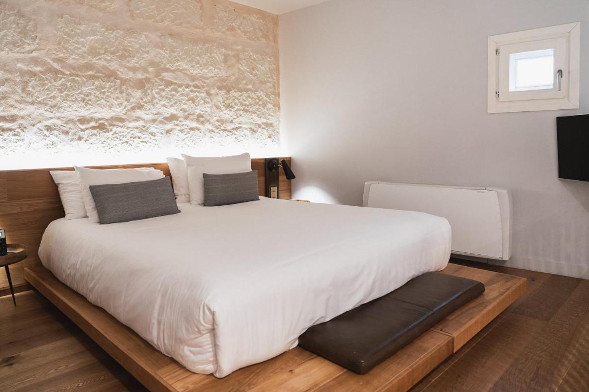 Cama o camas de una habitación en Puro Hotel Oasis Urbano