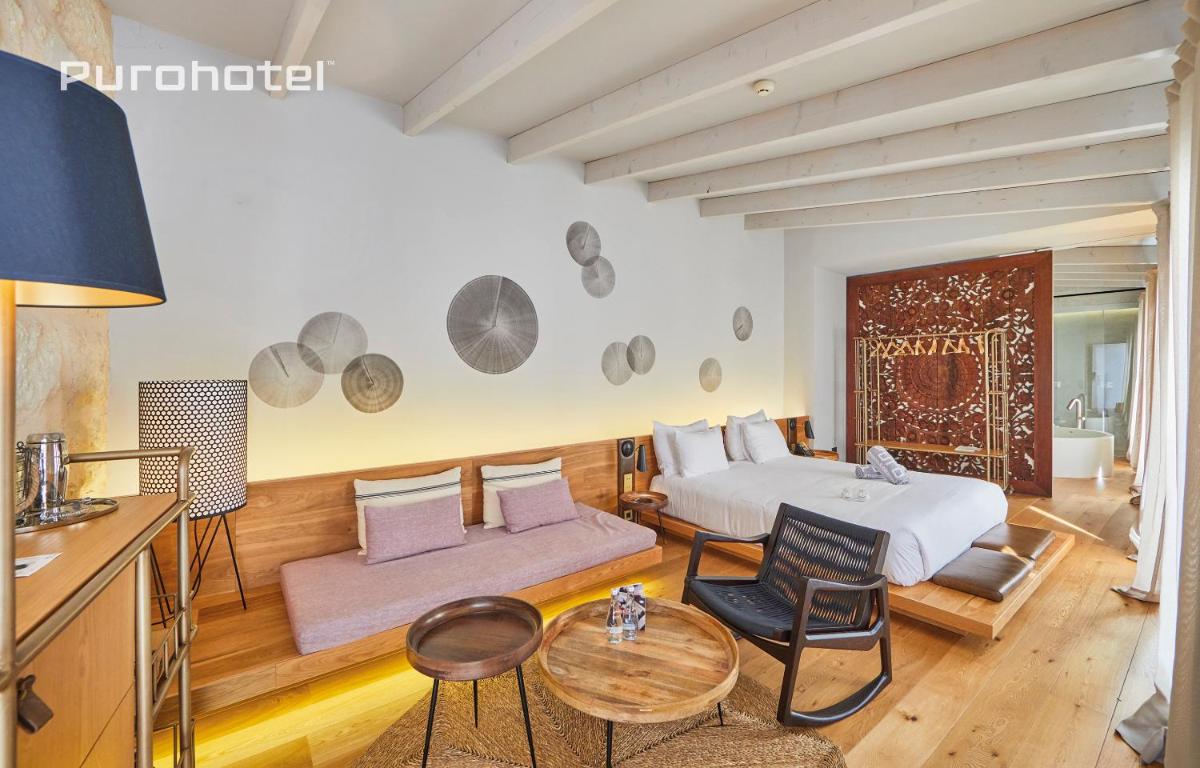 Cama o camas de una habitación en Puro Hotel Oasis Urbano