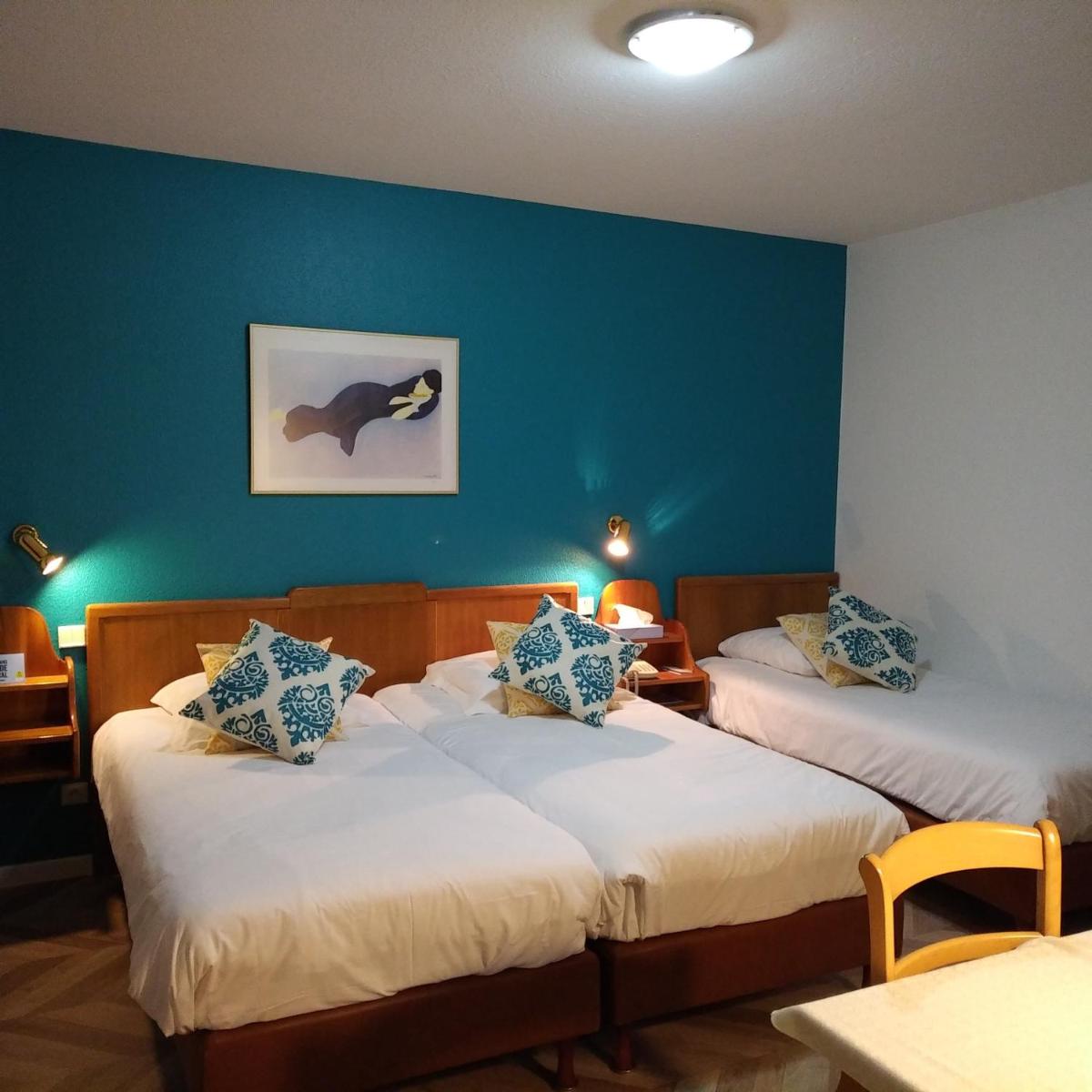 Un ou plusieurs lits dans un hébergement de l'établissement Logis Hôtel Notre-Dame - restaurant ouvert midi et soir sauf dimanche soir