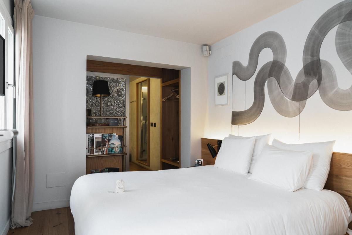 Cama o camas de una habitación en Puro Hotel Oasis Urbano