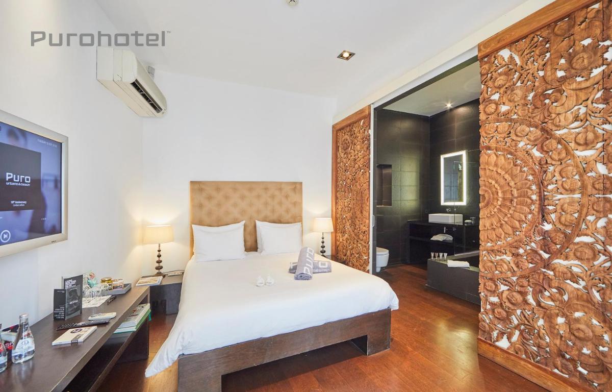 Cama o camas de una habitación en Puro Hotel Oasis Urbano