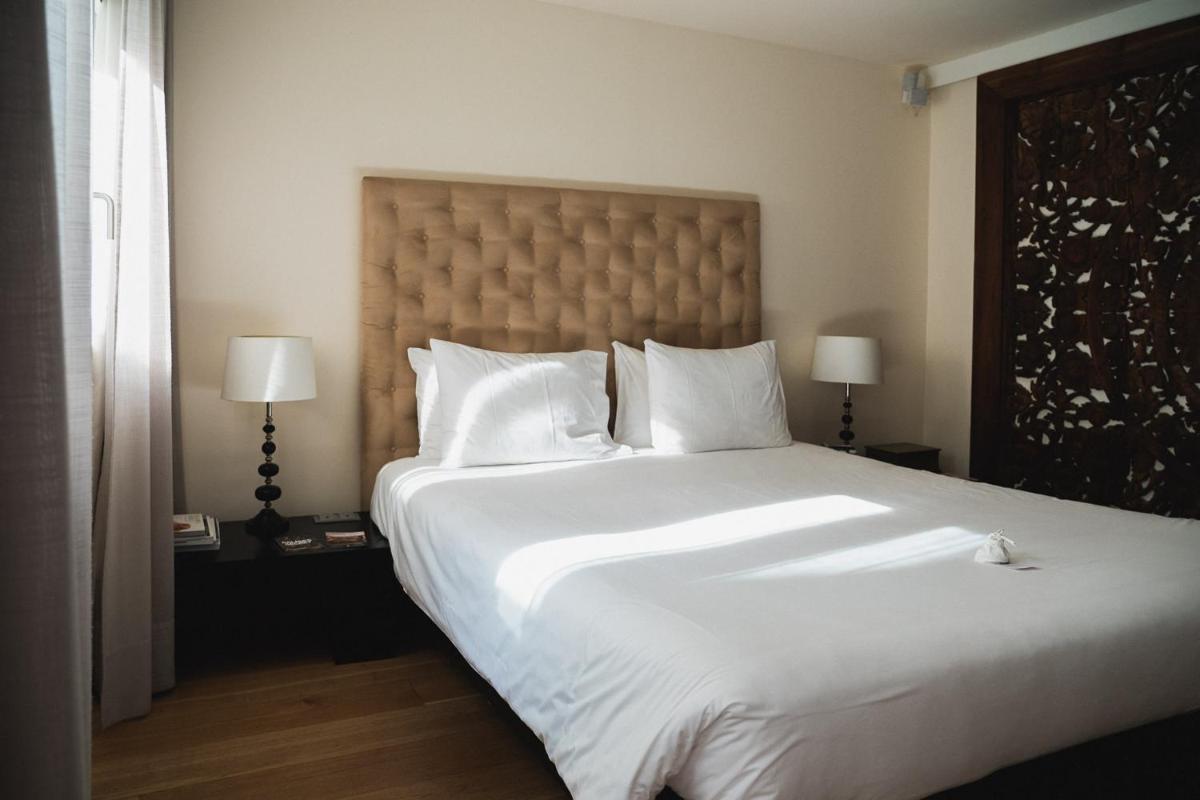 Cama o camas de una habitación en Puro Hotel Oasis Urbano