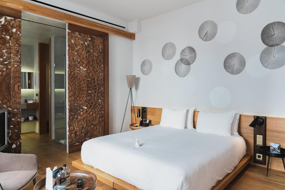 Cama o camas de una habitación en Puro Hotel Oasis Urbano