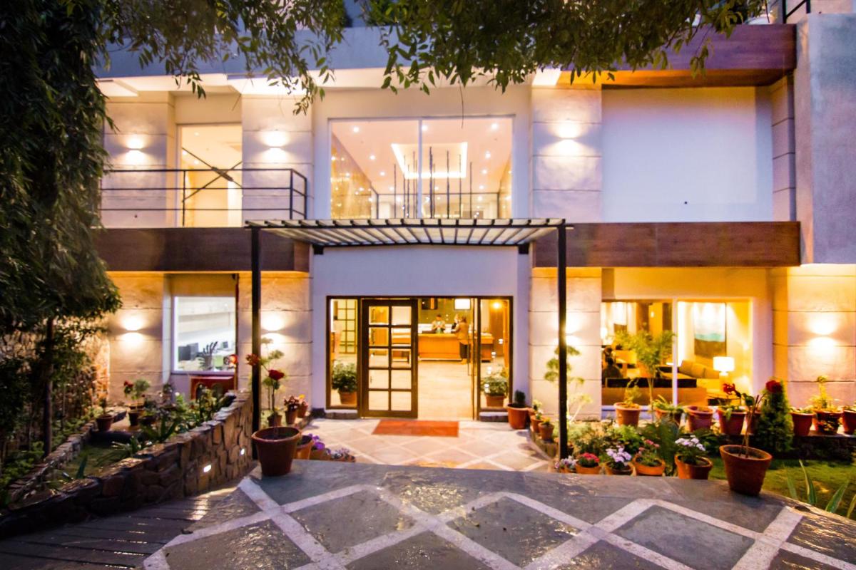 an exterior view of a house at night at Antalya By Divine Ganga Cottage in Rishīkesh