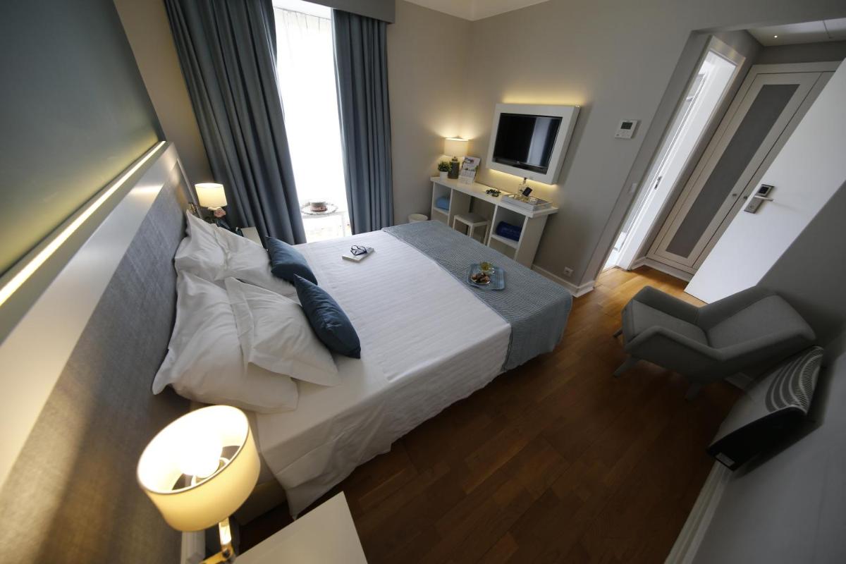 Uma cama ou camas num quarto em Grande Hotel das Caldas da Felgueira