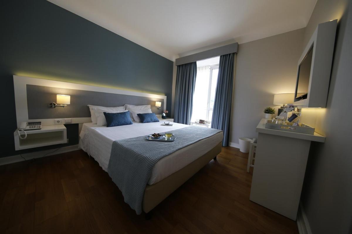 Uma cama ou camas num quarto em Grande Hotel das Caldas da Felgueira