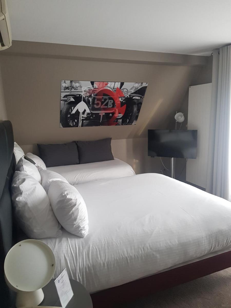 Un ou plusieurs lits dans un hébergement de l'établissement Best Western Plus Au cheval Blanc à Mulhouse
