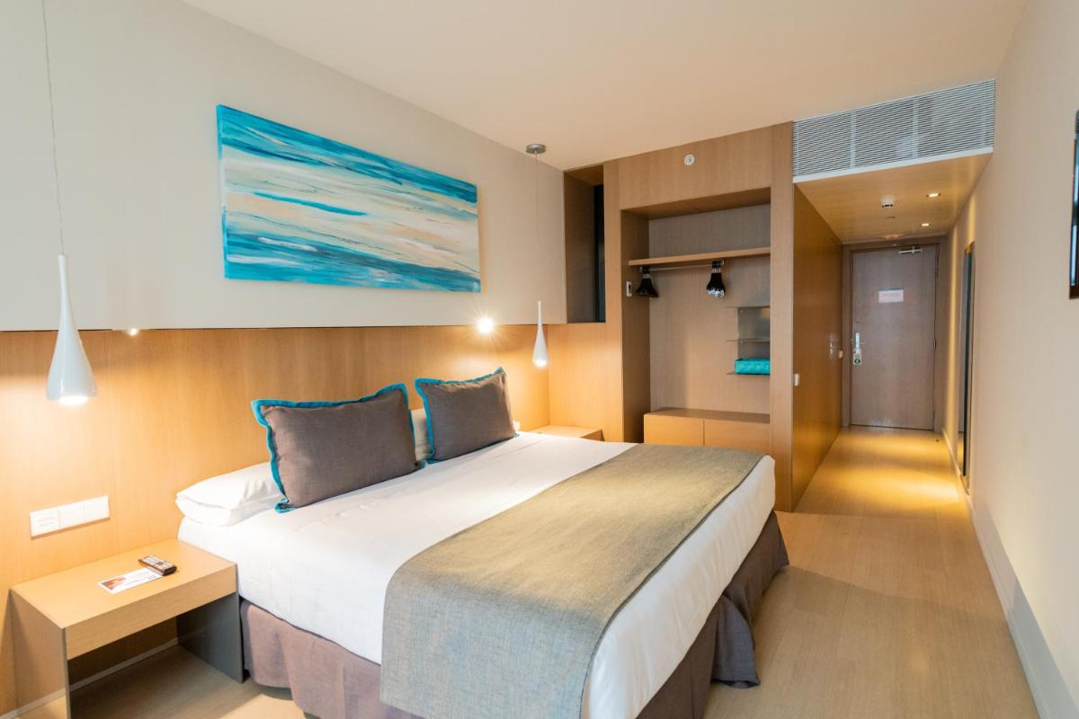 Cama o camas de una habitación en Atenea Port Barcelona Mataró