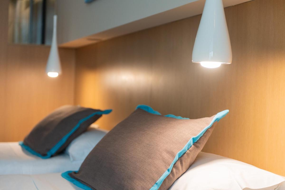 Cama o camas de una habitación en Atenea Port Barcelona Mataró