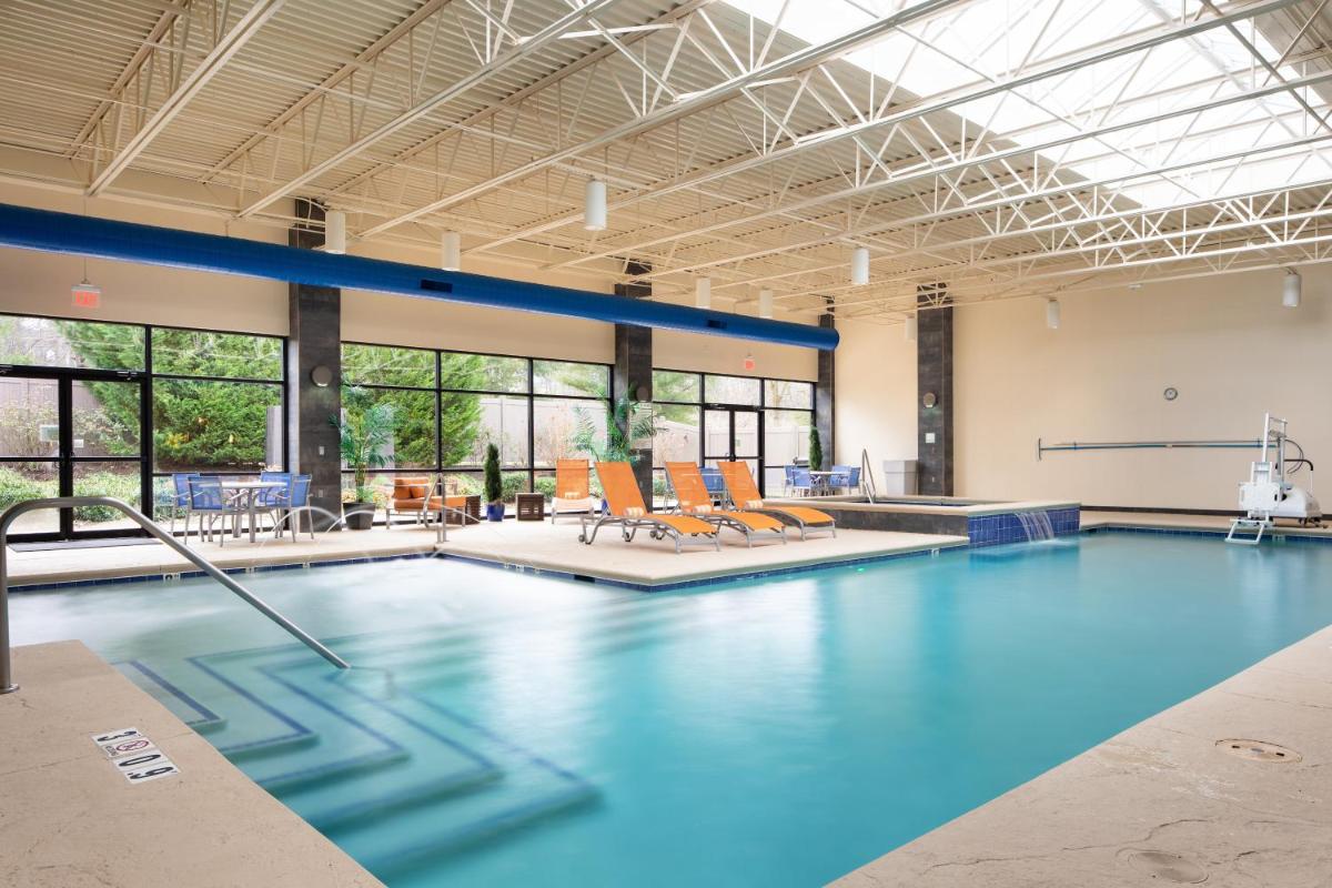 Holiday Inn and Suites Charleston West, an IHG Hotel - Housity
