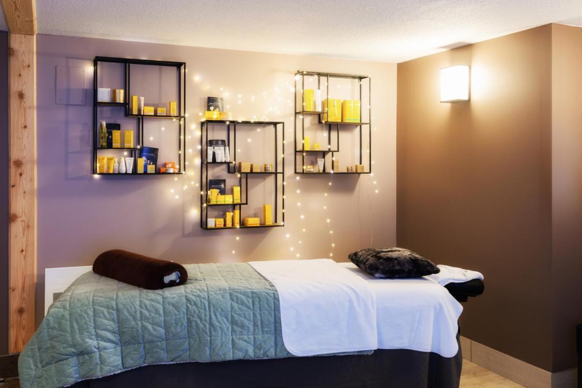 Un ou plusieurs lits dans un hébergement de l'établissement SOWELL HOTELS Le Parc & Spa