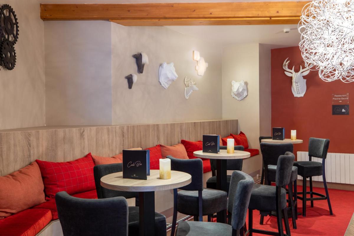 Coin salon dans l'établissement SOWELL HOTELS Le Parc & Spa