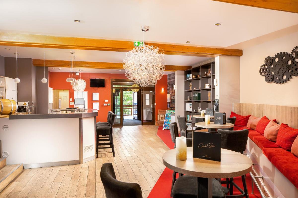 Coin salon dans l'établissement SOWELL HOTELS Le Parc & Spa