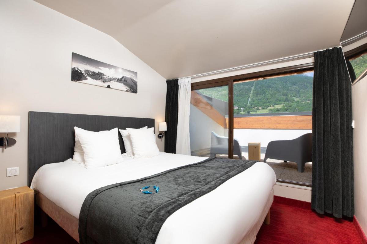 Un ou plusieurs lits dans un hébergement de l'établissement SOWELL HOTELS Le Parc & Spa