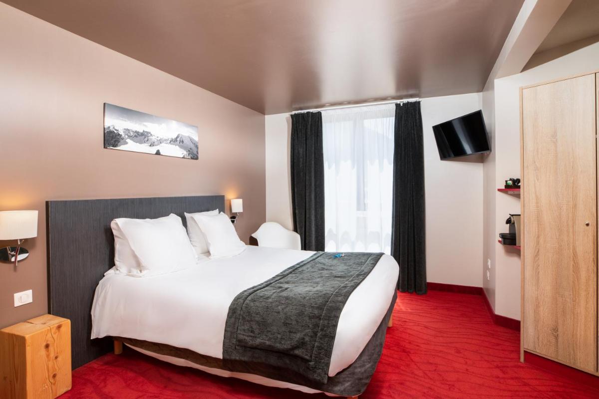 Un ou plusieurs lits dans un hébergement de l'établissement SOWELL HOTELS Le Parc & Spa