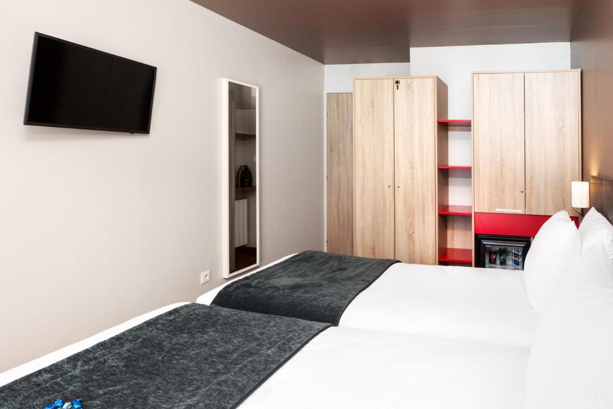 Un ou plusieurs lits dans un hébergement de l'établissement SOWELL HOTELS Le Parc & Spa