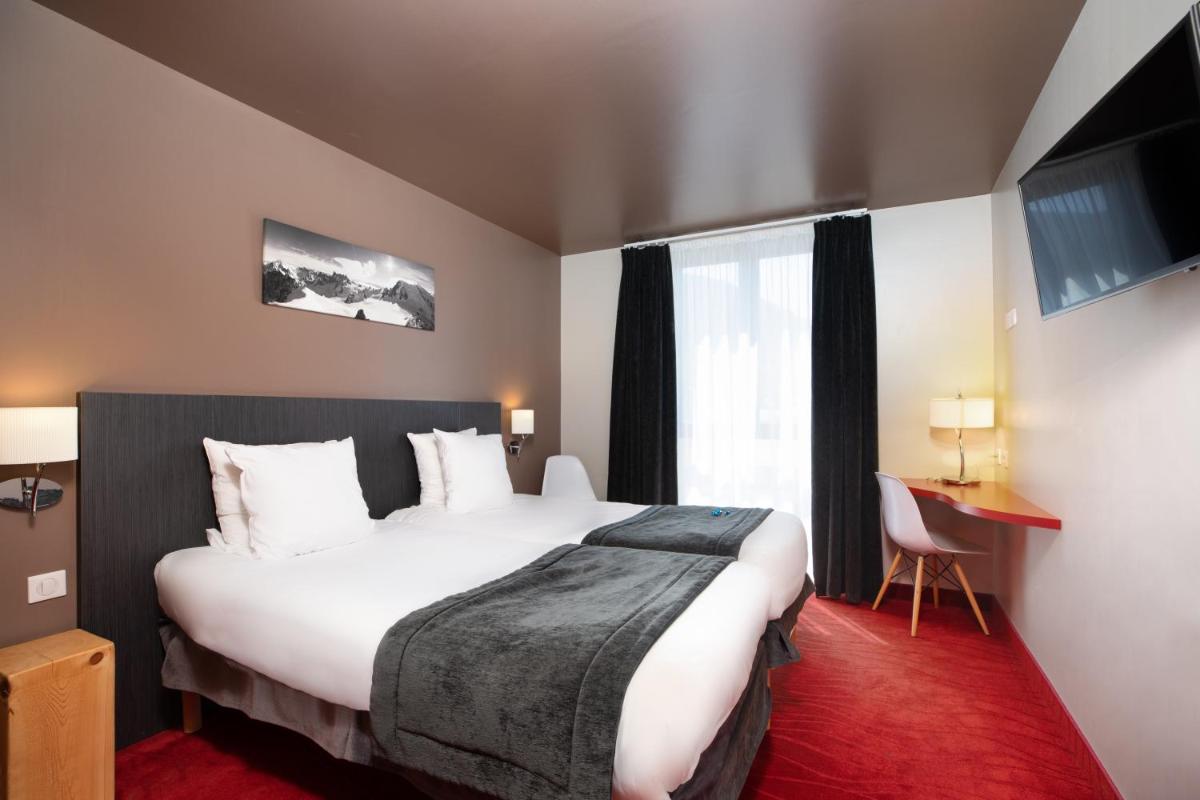 Un ou plusieurs lits dans un hébergement de l'établissement SOWELL HOTELS Le Parc & Spa