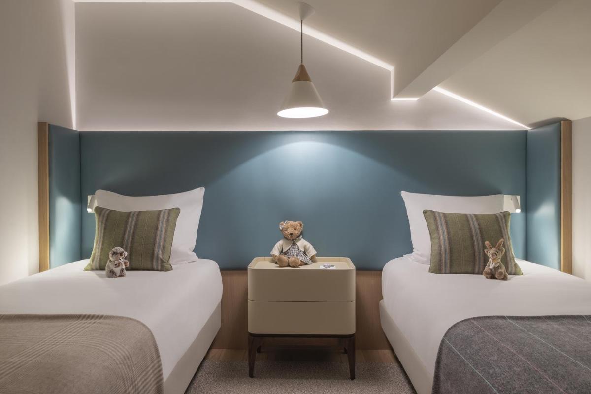 Un ou plusieurs lits dans un hébergement de l'établissement Hôtel Mont-Blanc Chamonix