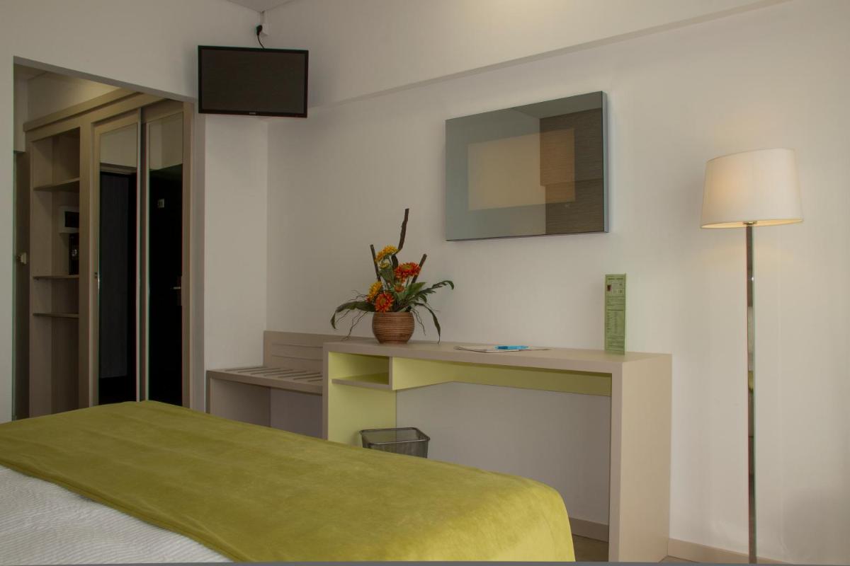 Uma cama ou camas num quarto em Hotel Navegadores