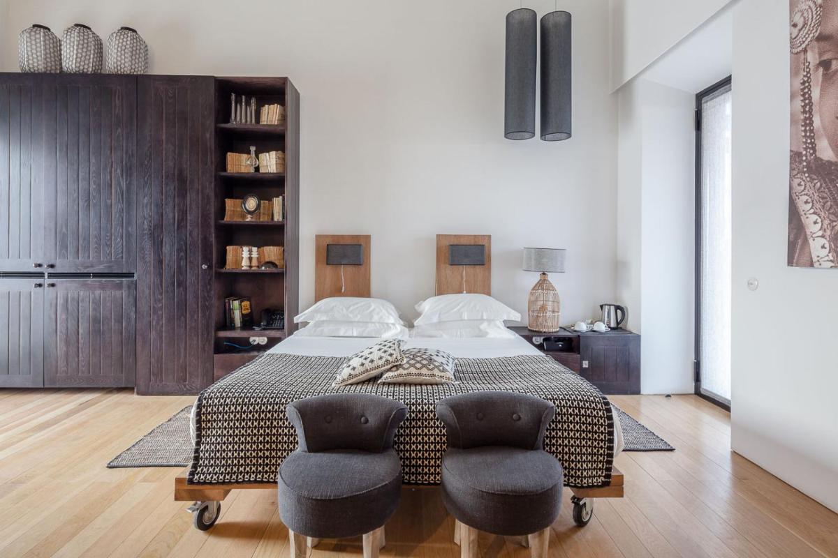 Uma cama ou camas num quarto em Torre de Palma Wine Hotel, Monforte, a Member of Design Hotels